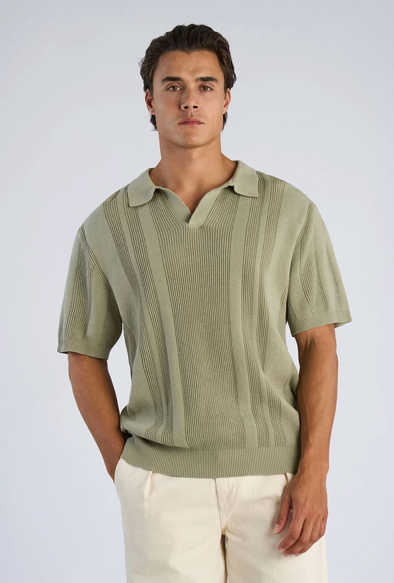Front image of a model wearing Knitted s/s polo in light green, by brand Lindbergh