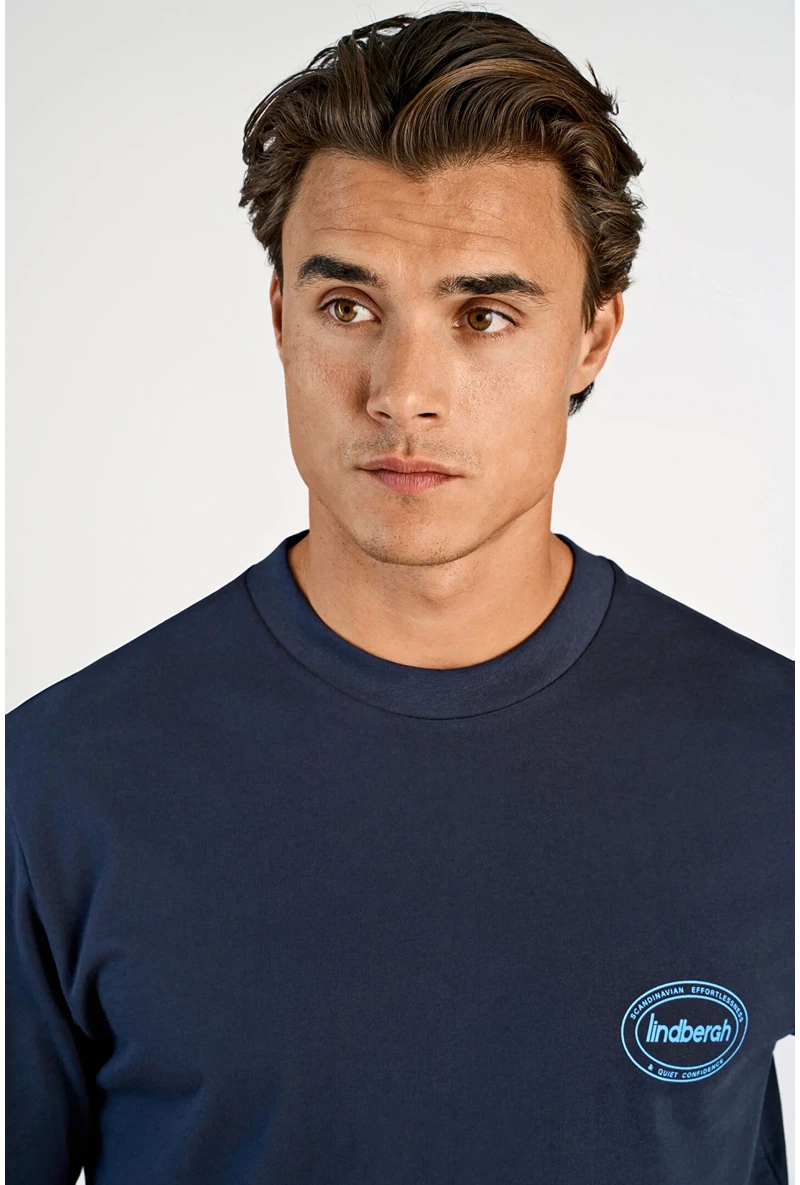 Front image of a model wearing Lemon squeezy oversize t in navy, by brand Lindbergh