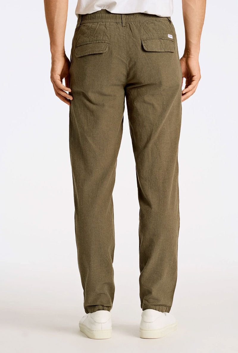 Back image of a model wearing Relaxed fit linen trousers in khaki, by brand Lindbergh