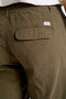 Back image of a model wearing the Relaxed fit linen trousers in khaki, by brand Lindbergh