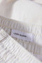 Detail image of the Relaxed fit linen trousers in white, by brand Lindbergh