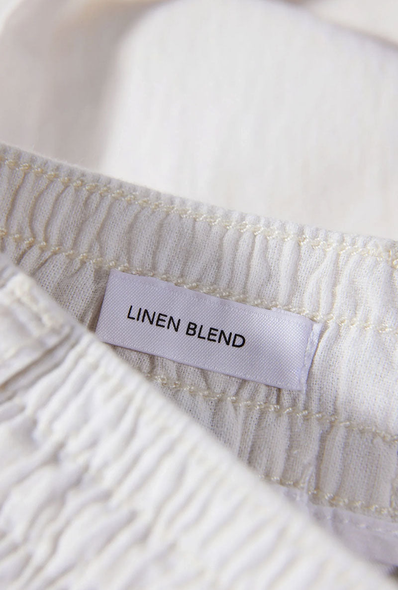 Detail image of Relaxed fit linen trousers in white, by brand Lindbergh