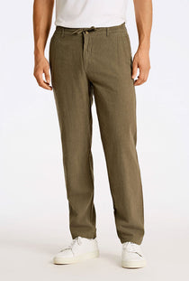 Front image of a model wearing the Relaxed fit linen trousers in khaki, by brand Lindbergh