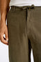 Front image of a model wearing the Relaxed fit linen trousers in khaki, by brand Lindbergh