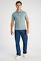 Front image of a model wearing the S/s contrast polo in aqua, by brand Lindbergh