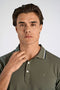 Front image of a model wearing the S/s contrast polo in khaki, by brand Lindbergh