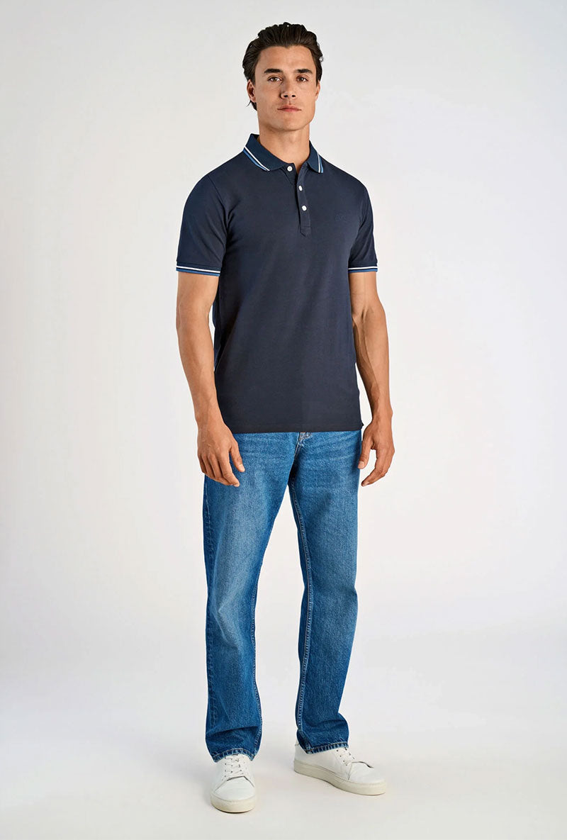Front image of a model wearing S/s contrast polo in navy, by brand Lindbergh