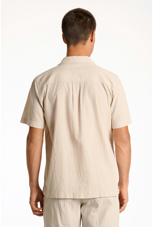 Back image of a model wearing the Seersucker s/s shirt in beige, by brand Lindbergh