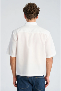 Back image of a model wearing the Solid dobby s/s shirt in white, by brand Lindbergh