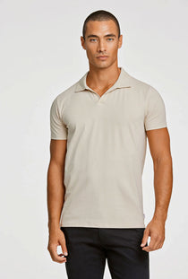 Front image of a model wearing the Stretch s/s polo shirt in stone, by brand Lindbergh