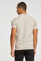 Back image of a model wearing the Stretch s/s polo shirt in stone, by brand Lindbergh