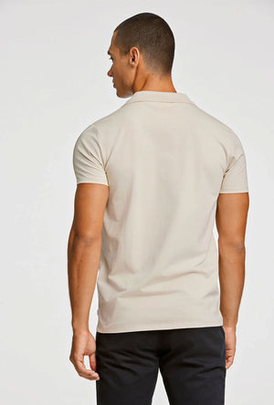 Back image of a model wearing the Stretch s/s polo shirt in stone, by brand Lindbergh