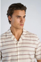 Front image of a model wearing the Striped structure s/s shirt in brown, by brand Lindbergh