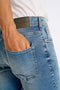 Back image of a model wearing the Superflex denim shorts in dark denim, by brand Lindbergh