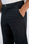 Front image of a model wearing the Superflex relaxed fit chino pants in black, by brand Lindbergh
