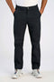 Front image of a model wearing Superflex relaxed fit chino pants in black, by brand Lindbergh