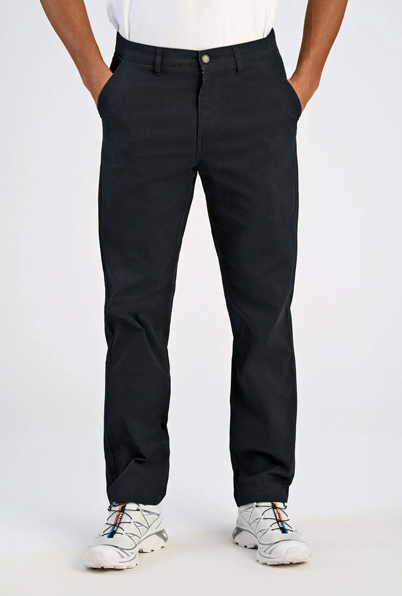 Front image of a model wearing Superflex relaxed fit chino pants in black, by brand Lindbergh
