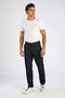 Front image of a model wearing the Superflex relaxed fit chino pants in black, by brand Lindbergh