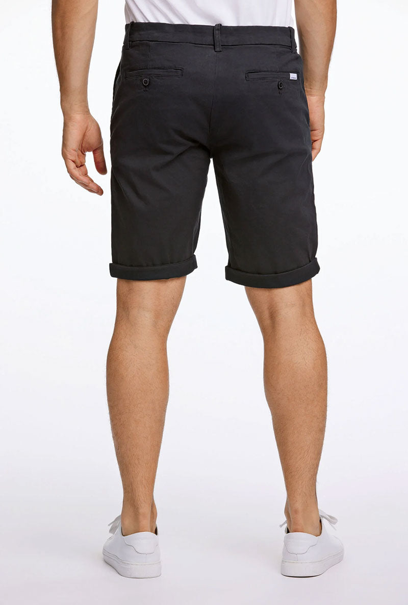 Back image of a model wearing Superflex relaxed fit chino shorts in black, by brand Lindbergh
