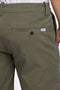 Back detail image of a model wearing the Superflex relaxed fit chino shorts in khaki, by brand Lindbergh