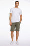 Front image of a model wearing the Superflex relaxed fit chino shorts in khaki, by brand Lindbergh