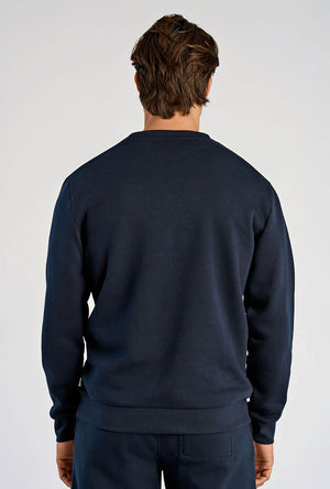 Back image of a model wearing the Lindbergh sweatshirt in navy, by brand Lindbergh