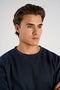 Front image of a model wearing the Lindbergh sweatshirt in navy, by brand Lindbergh