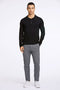 Front image of a model wearing the Ecovero ls polo in black, by brand Lindbergh
