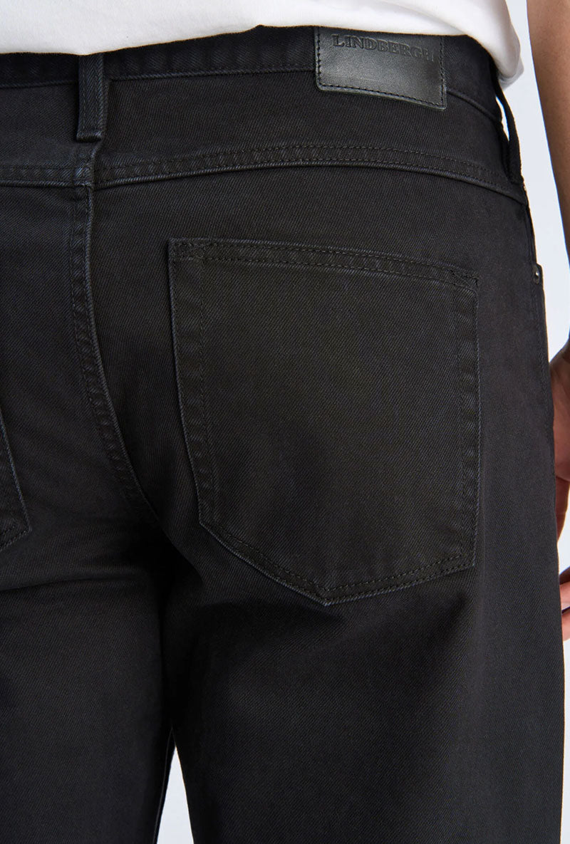 Back image of a model wearing Loose fit jeans in black, by brand Lindbergh