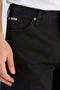 Front image of a model wearing the Loose fit jeans in black, by brand Lindbergh