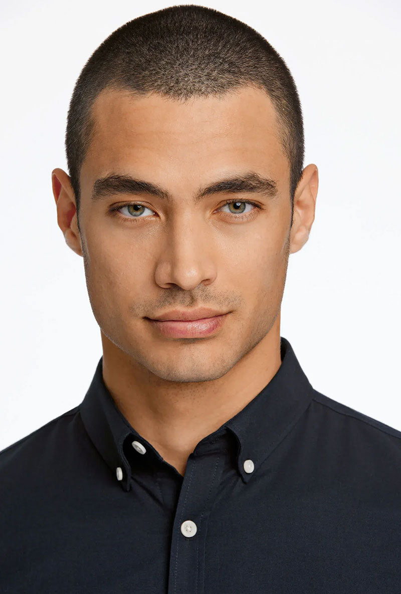 Front image of a model wearing Oxford superflex ls shirt in black, by brand Lindbergh
