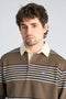 Front image of a model wearing the Rugby polo sweatshirt in brown, by brand Lindbergh