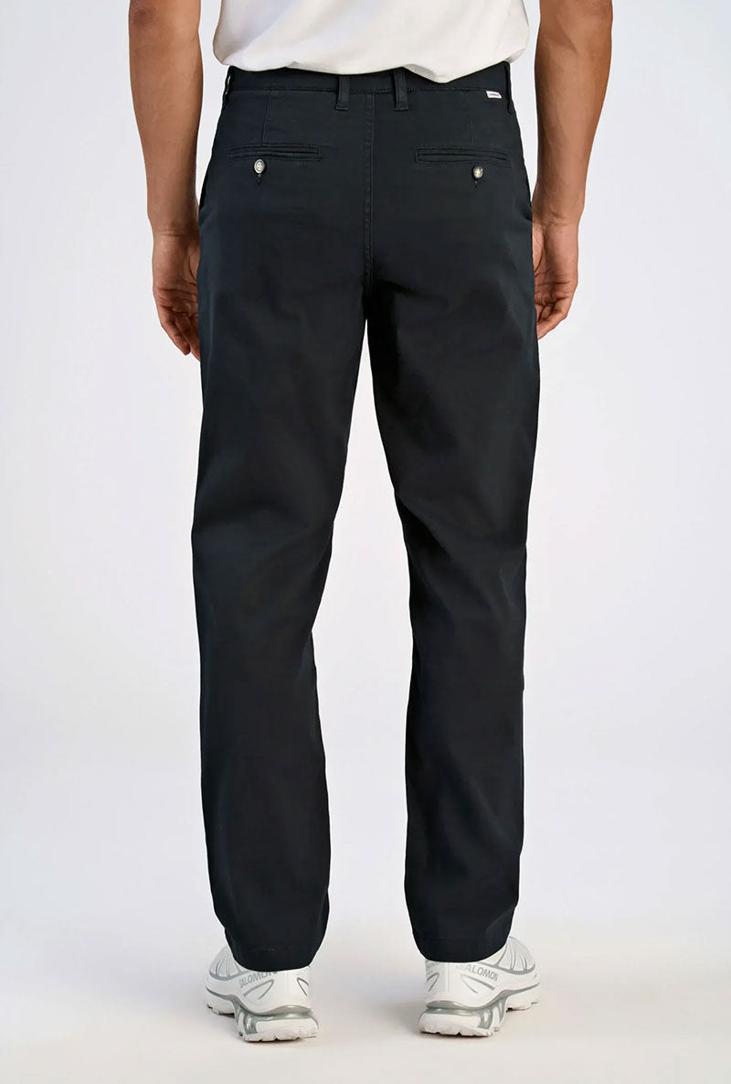Back image of a model wearing Superflex chino pants in black, by brand Lindbergh