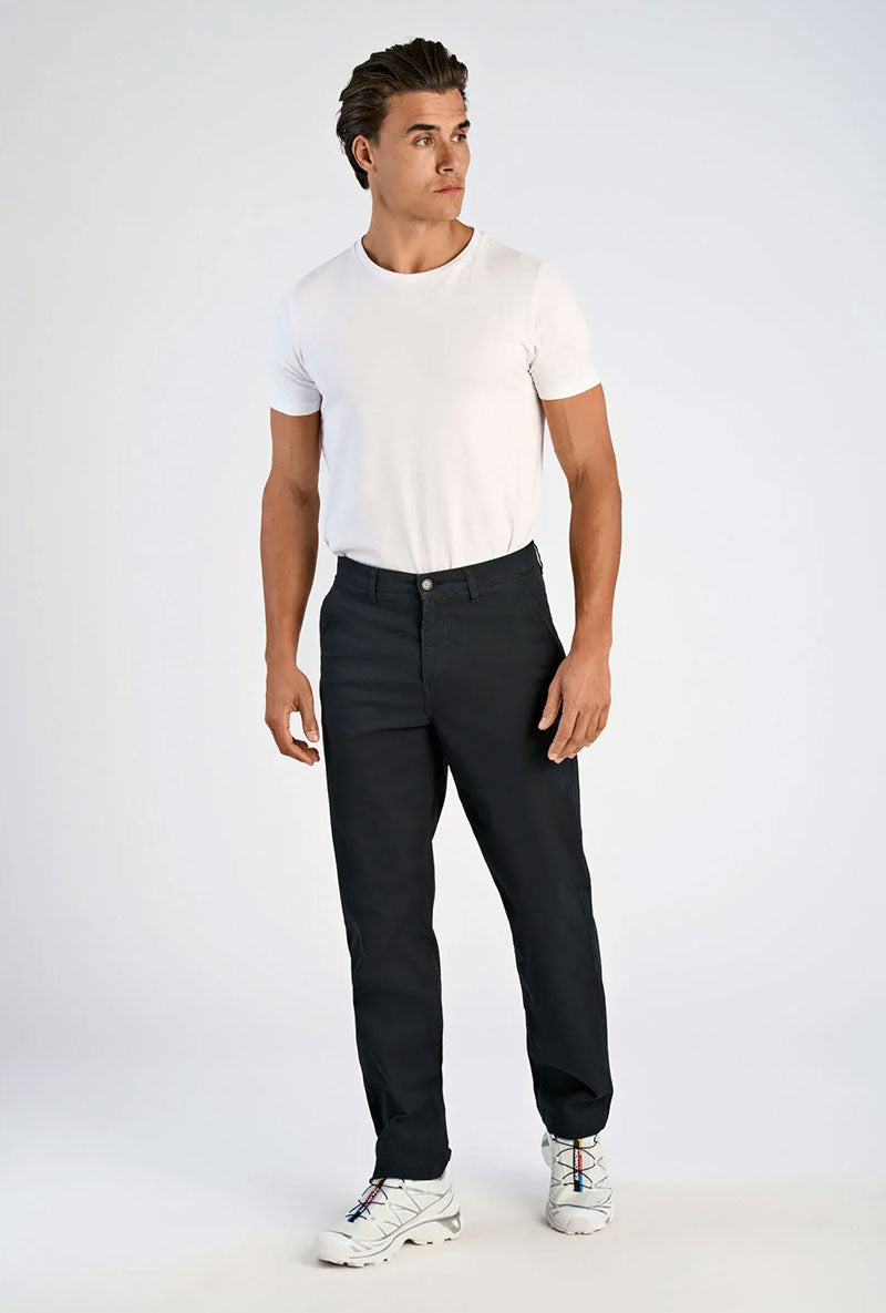 Front image of a model wearing Superflex chino pants in black, by brand Lindbergh