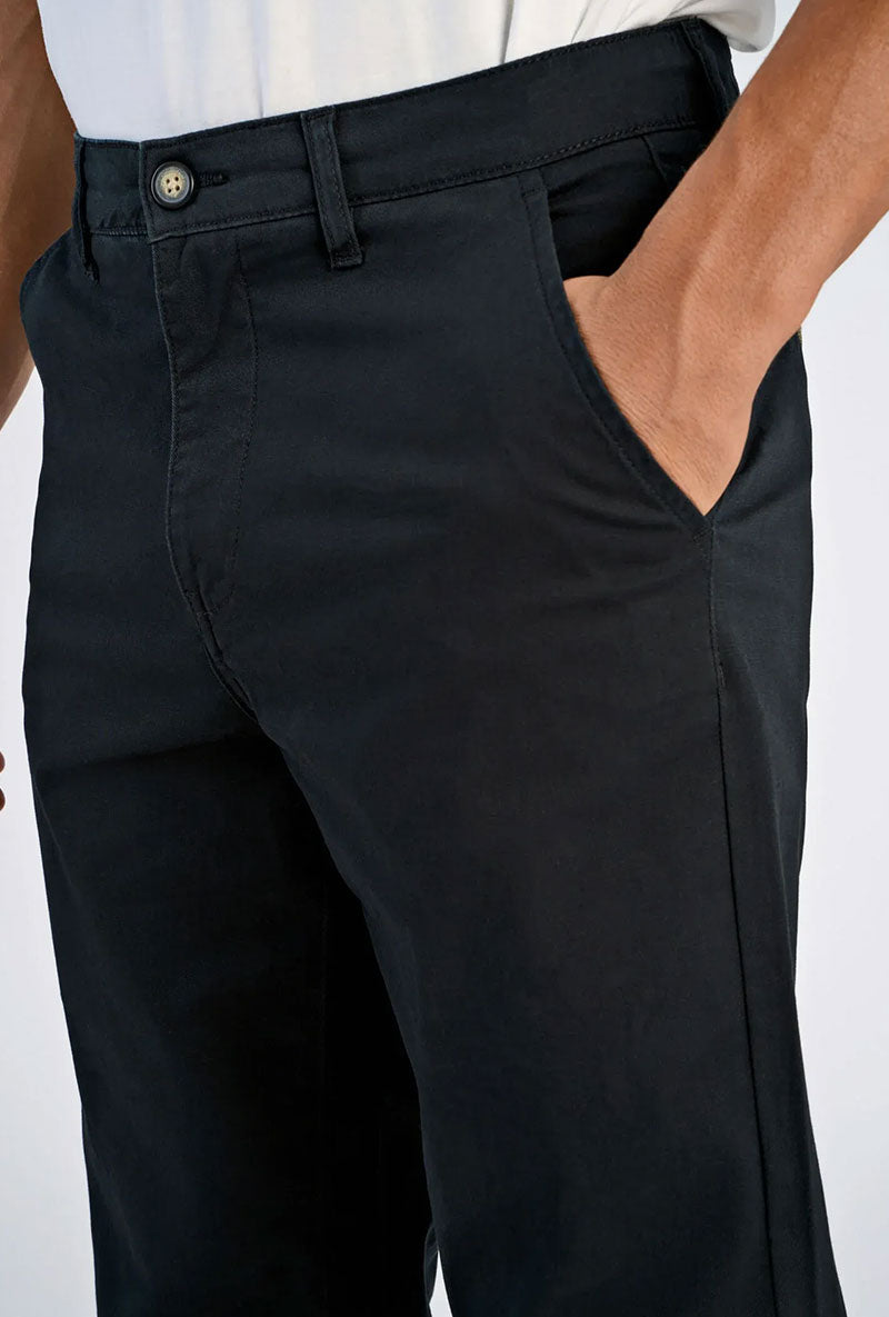 Front image of a model wearing Superflex chino pants in black, by brand Lindbergh
