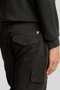 Back detail image of a model wearing the Lyle and scott cargo pocket trousers in black, by brand Lyle and scott