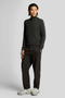 Front image of a model wearing Lyle and scott cargo pocket trousers in black, by brand Lyle and scott
