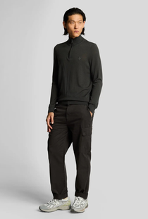 Front image of a model wearing the Lyle and scott cargo pocket trousers in black, by brand Lyle and scott