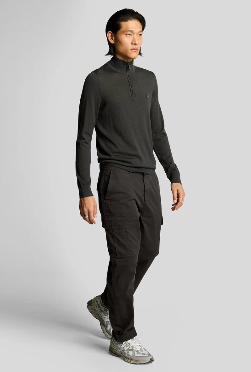 Front image of a model wearing Lyle and scott cargo pocket trousers in black, by brand Lyle and scott