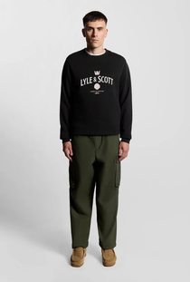 Front image of a model wearing the Lyle and scott cheers to tradition sweatshirt in black, by brand Lyle and scott