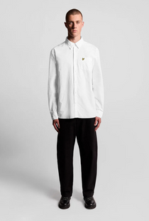 Front image of a model wearing the Lyle and scott plain oxford shirt in white, by brand Lyle and scott