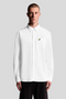 Front image of a model wearing the Lyle and scott plain oxford shirt in white, by brand Lyle and scott