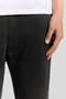 Front detail image of a model wearing the Lyle and scott straight leg jogger in black, by brand Lyle and scott