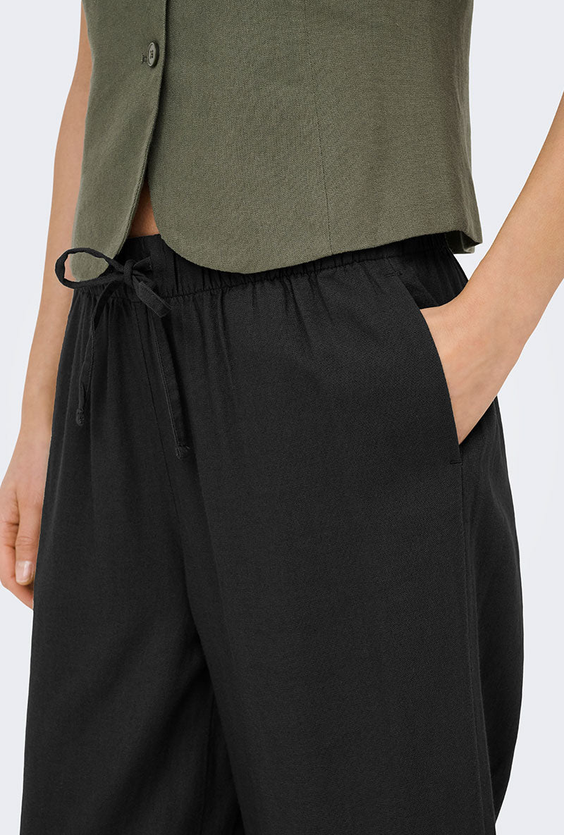 Front image of a model wearing Goa mw linen pull up culotte pants in black, by brand Only