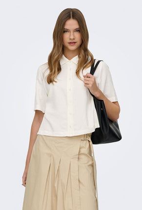 Front image of a model wearing Goa s/s linen shirt in off white, by brand Only
