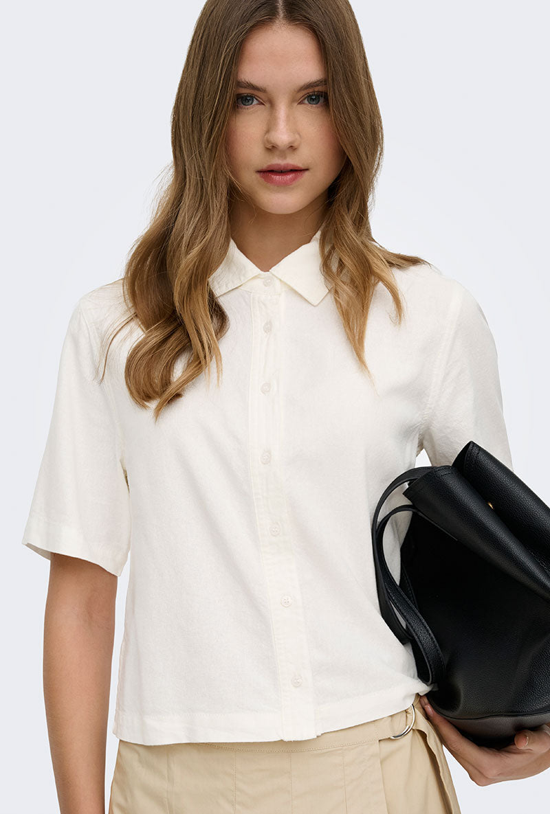 Front image of a model wearing Goa s/s linen shirt in off white, by brand Only