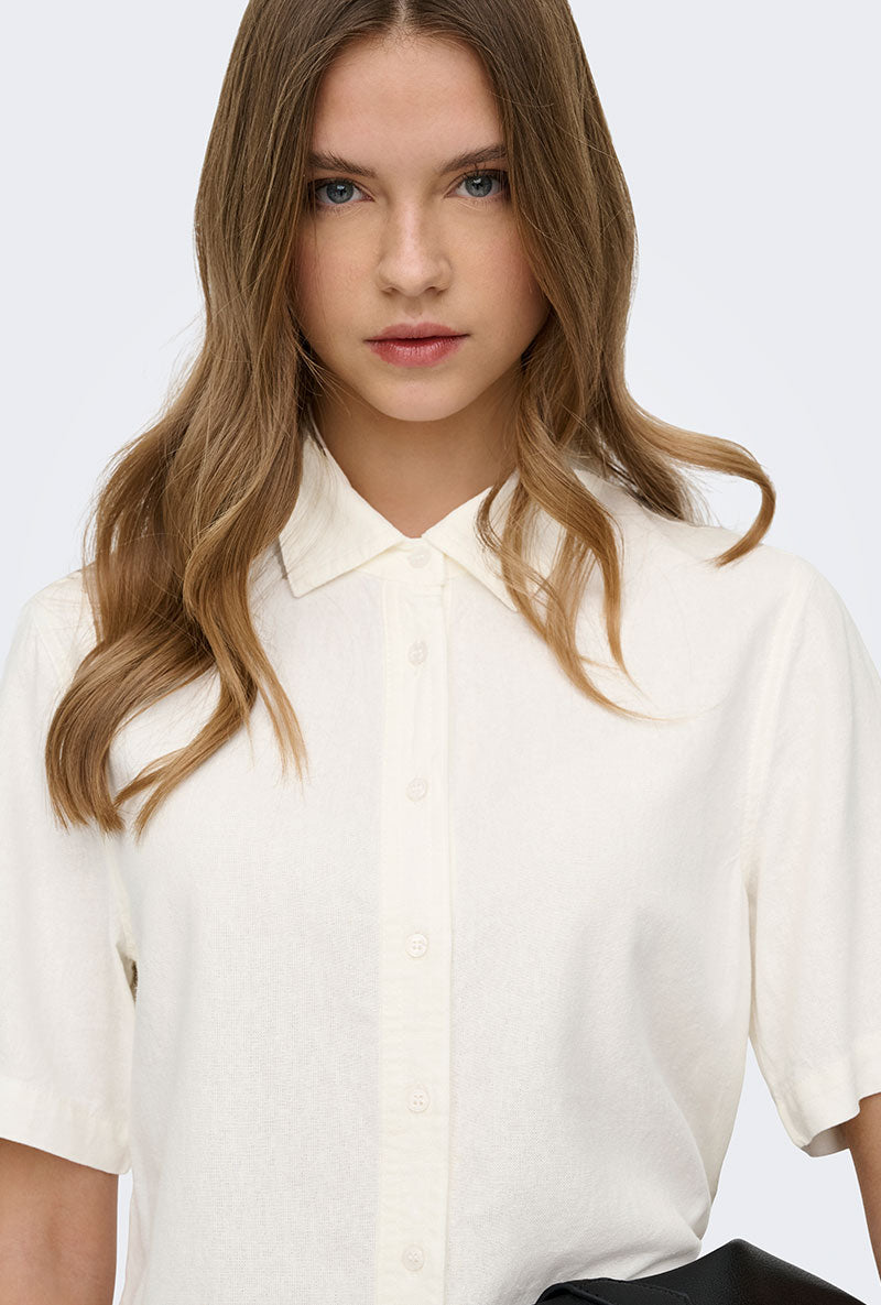 Front image of a model wearing Goa s/s linen shirt in off white, by brand Only