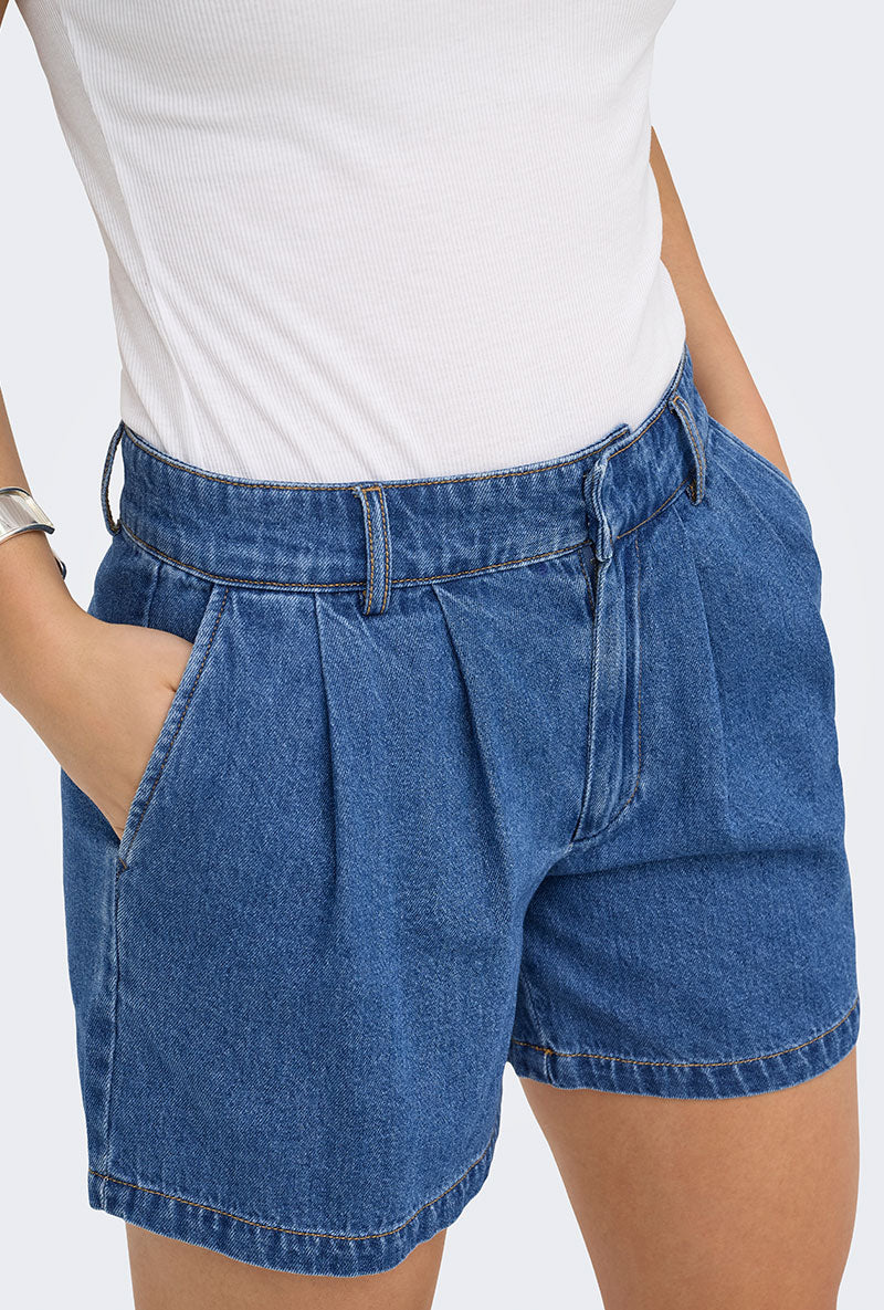 Front image of a model wearing Luka mw chino denim shorts in denim, by brand Only