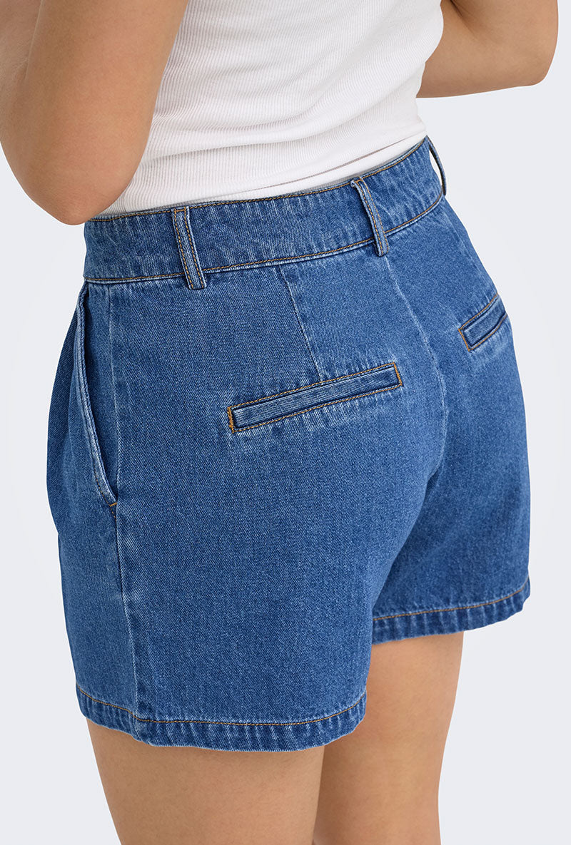 Back image of a model wearing Luka mw chino denim shorts in denim, by brand Only