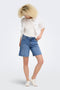 Front image of a model wearing the Lumi mw mom shorts in denim, by brand Only